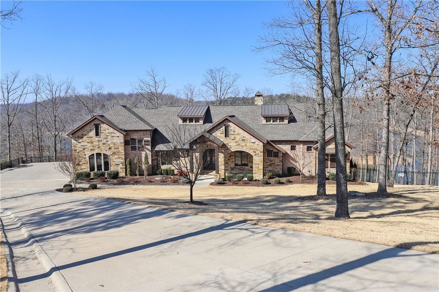 CUSTOM BUILT LAKEFRONT ESTATE OFFERING GORGEOUS LAKE VIEWS & PRIVATE 2 SLIP BOAT DOCK!  Beautiful 2.60 acre setting w/easy access to lake & dock!  Spacious screened deck & huge lower patio w/hot tub & fire pit!  The stunning interior offers top of the line amenities throughout including wood flooring, knotty alder cabinetry, granite, custom wall finishes, high ceilings w/ rustic beams and large picture windows offering fabulous views!  Walk-out basement w/bonus, bed, full bath!  Don&#x2019;t miss this PRISTINE custom estate!!