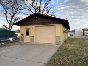 Great shop space in town w/small office, 1/2 bath and roll up door. Perfect to run your small business, use for storage or lease out for the income!