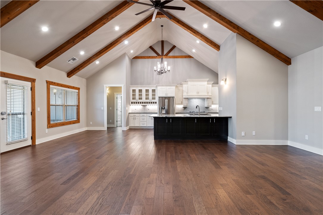 This well kept 4 bedroom home is a must see! You will find ample space at every turn from the cathedral ceilings, well appointed open floor plan, walk in closets in every bedroom, and extra storage throughout. You will have room for any occasion. Enjoy entertaining in your outdoor kitchen under the covered patio complete with fire-pit area. Looking for additional storage space in the garage? This home comes with custom cabinetry, a work station, and slat walls throughout. A few of the luxurious additions include: primary suite set up for a second washer and dryer in the walk in closet, home is plumbed for a central vac (canister and equipment to be provided by buyer), water hook up in the first garage bay, and a tankless water heater. This home is centrally located less than 3 miles to I-49 and 7 miles from all that downtown Bentonville has to offer. The peacefulness of this neighborhood will draw you home!