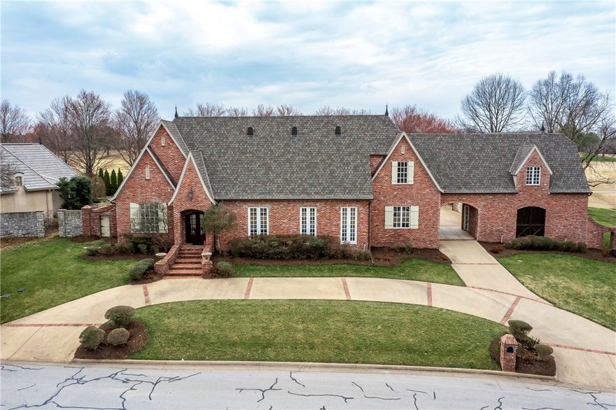 Luxury golf front living in gated Pinnacle Country Club with expansive view overlooking the 10th fairway, a short golf cart ride to the driving range or clubhouse. Architecturally designed Jack Arnold estate home invites you into an open spacious floor plan featuring Amish Hand-Hewn wood beams adorning cathedral ceilings, detailed millwork, designer lighting, 5 indoor fireplaces. Cozy hearth room w/awe-inspiring kitchen w/Thermador appliances, pot-filler and scullery. Intimate primary suite offers fireside sitting area, oversized wic, spa-like bath w/marble floors & vanities, view of the lushly landscaped backyard and golf course. Main level boasts a formal dining and living area, additional sitting area w/backyard view/access, study, and 2nd bedroom & bath. Upstairs bonus area, 2 bedrooms, 2 baths, walk-in attic w/various possibilities. Detached studio apartment, tornado shelter, hobby room, 3-car garage-Tesla wall charger, plus golf car garage. A truly unique home in prime locale of Pinnacle Hills.