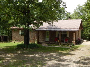PERFECT SETTING FOR A PERFECT HOUSE. This three bedroom home features a large living room with fireplace, eat in kitchen, covered deck off the dining area for those quiet peaceful moments, metal roof only a year old. New Heat and Air, new Hot Water tank. You will fall in love with this property.