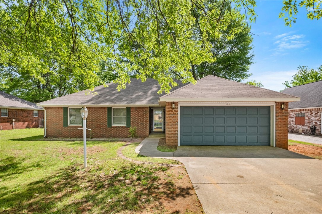 Welcome to this well-maintained 3-bedroom, 2-bath home in the heart of Lowell! Offering 1,618 sq ft of comfortable living space on a generous 0.71-acre lot, this property combines peaceful living with quick access to shopping, dining, and all the amenities of Northwest Arkansas.
Enjoy the added value of a 24x20 heated shop—perfect for projects, storage, or a home workspace—plus a 12x12 storage building for your extra tools or outdoor gear. The spacious yard offers endless possibilities for entertaining, gardening, or simply relaxing.
Inside, you'll find a warm and inviting layout with a functional kitchen, cozy living area, and comfortable bedrooms ready to make your own. A rare find with this much space and flexibility—don’t miss the opportunity to make it yours!