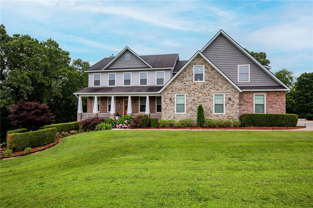 Welcome to 11010 Meadow Lark Rd in Rogers, Arkansas. First time ever on the market, this custom-built dream home is nestled at the end of a quiet cul-de-sac on 2.53 acres, backing up to mature trees for a peaceful, wooded backdrop. Ideally located just 10 minutes from downtown Rogers and less than 20 minutes from the new Walmart Home Office, this property offers both convenience and privacy.
With three spacious levels and a total of 5,130 heated square feet, there’s plenty of room to spread out while still enjoying a warm and inviting atmosphere. Thoughtfully designed with quality craftsmanship throughout, the home features a safe room, a partial backup generator, and energy-efficient solar panels that keep utility bills remarkably low. Perfectly suited for everyday living and entertaining, this one-of-a-kind retreat offers timeless finishes, modern comforts, and a tranquil setting you’ll fall in love with the moment you step inside. Don’t miss your chance to own this sanctuary in the heart of Northwest Arkansas.