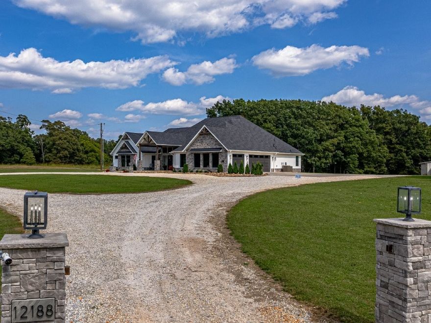 Step into the charm of this delightful 3,600 SF home with 4 cozy bedrooms nestled on 20.47 picturesque acres. This gem includes a spacious 3,796 SF shop with a 1,400 SF lean-to for equipment and a 1,652 SF complete Apartment, used as a part-time Airbnb retreat with good reviews. Embrace the farm-like allure, just a stoneās throw from town, enhanced by paid-off solar panels system generating enough power to cover the house and shop. Enjoy thoughtful touches like central vacuum, spray foam insulation, radiant board heating, a covered porch, open/covered patios, a sprinkler system, security features, indoor/outdoor wood fireplaces, and a safe storm shelter. Delight in a powered greenhouse, thriving garden, serene pond, and an outbuilding with a powered chicken coop. Inside, find granite countertops, an oversized kitchen island, clever built-ins, and blackout shades throughout. A true haven of luxury.