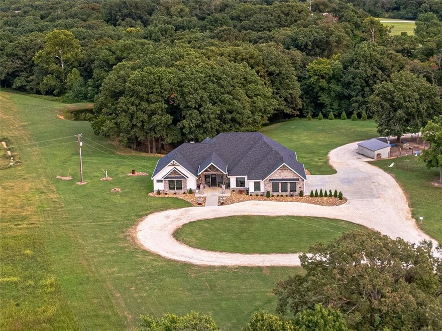 Prime development opportunity in Bentonville: 20.47 acres total, split into two parcels. The 8.47-acre lot is fully cleared and ready for build-out. The 12-acre parcel includes a 3,600 SF residence with 4 bedrooms, plus a 3,796 SF shop with 1,400 SF lean-to and a 1,652 SF apartment (currently part-time Airbnb for income). Seller offers $100,000 credit at closing. Ideal for builders, investors, or developers seeking high-growth land in Bentonville’s core. The home sits on 20.47 picturesque acres with farm-like charm, minutes from town. Features paid-off solar panels powering house and shop, central vacuum, spray foam insulation, open/covered patios, sprinkler system, security, indoor/outdoor wood fireplaces, and storm shelter. Outdoor amenities include a powered greenhouse, garden, pond, and outbuilding with powered chicken coop. Inside: granite countertops, oversized kitchen island, blackout shades throughout.