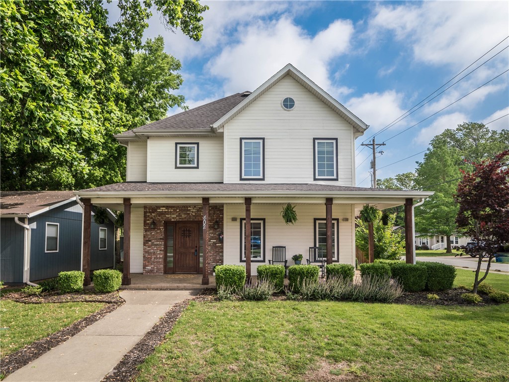 Beautifully updated home in Downtown Bentonville. Built in 2011 by Dave Marrs of HGTV's "Fixer to Fabulous". The home is located across the street 3 blocks off the square. Garage Apartment over the 3 car attached garage with plenty of space for guests. All bedrooms on 2nd level. The brick wall accents and double sided fireplace add to the character of the home. Whether you are enjoying sitting on your front porch or entertaining in the backyard stone patio this home has plenty of space indoors and out. Custom concrete bar that looks out over the stone patio. Flexible space that could be a home office or play room. Hidden tornado shelter inside the home. Truly a rare find in Downtown Bentonville.