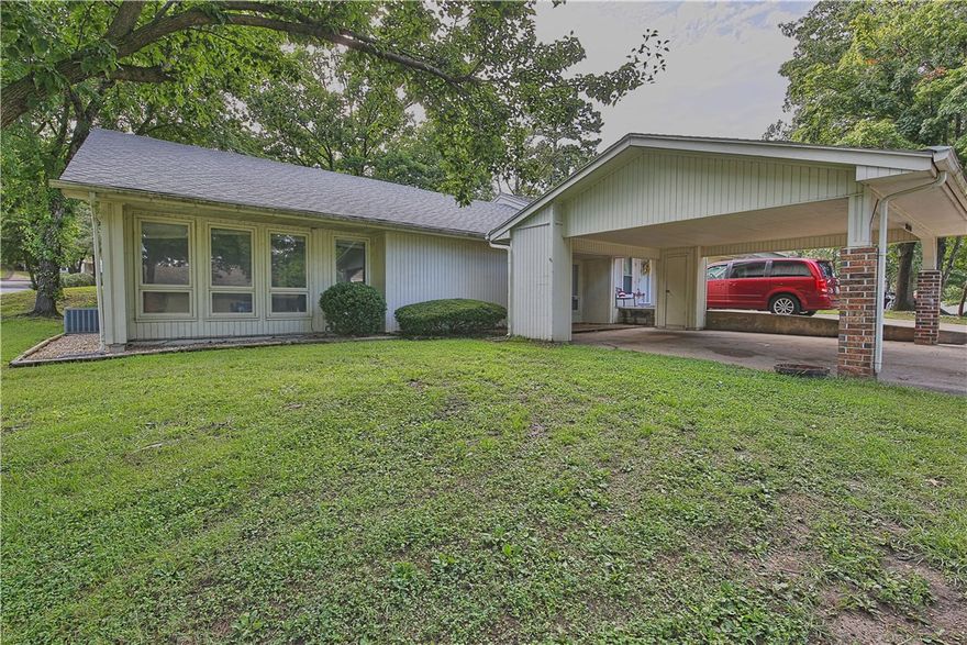 Investment opportunity in Bella Vista. Town house with great rental history, currently rented at $1100 a month with a lease in place until 8/31/2020. Recently updated with new flooring and paint. This home features large floor to ceiling windows that let in ample light. The property has a large fenced in back patio with a storage building and a 2 car covered carport with extra storage