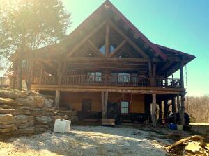 Spectacular custom built log home, built with massive, old growth pine logs. 3 bedrooms, 3 baths, cathedral ceilings, cultured stone fireplace, bamboo floors. Awesome kitchen with hackberry cabinets and corian sold surface countertops. 3 car garage. Unfinished basement set up for 4th bedroom and plumbed for 4th bathroom and kitchenette. Wraparound covered porches. 10 acres with a beautiful view of the Ozark Mountains. Very near the Buffalo River National Park.