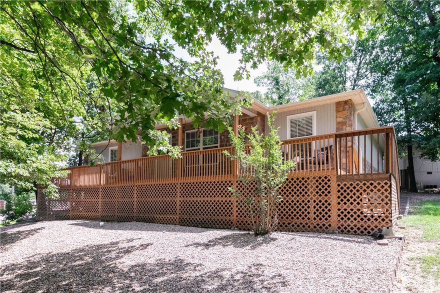 Charming home with an updated interior on a flat cul-de-sac lot, conveniently located next to the Landline and Tunnel Vision Trail! Enjoy quick access to the OZ Bike Lift, Lake Windsor, Kingswood Golf Course, and Tanyard Creek, all just a few minutes away! Currently utilized as an active Airbnb, this 3-bedroom / 2-bathroom home features a 2 car garage and a spacious open floor plan with LVP flooring throughout—no carpet! Additional features include 3 cm quartz countertops, new fixtures, and a large covered patio with wooded views! Tons of updates throughout! Refrigerator, washer, and dryer convey. Bentonville schools! Furnishings are available for purchase. Plus, take advantage of $3,000 in buyer's closing costs, courtesey of the seller's preferred lender.