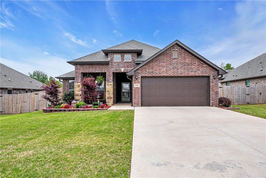 Welcome to 5339 Clear Springs Ave in Springdale's sought-after Deere Creek subdivision! This 2023-built, all-brick Craftsman home shows like new and is truly move-in ready. With 3 bedrooms, 2 bathrooms, and 2,059 sq ft of thoughtfully designed living space, you'll love the split floor plan, soaring cathedral ceilings, and gorgeous granite countertops. The kitchen shines with a gas range, built-in microwave vent, dishwasher, and pantry — perfect for everyday living and entertaining. Cozy up by the electric fireplace or step outside to the covered patio in a beautifully landscaped, fenced backyard. A 2-car attached garage plus a 120 sq ft storage building give you all the space you need. Walk-in closets, double-pane windows, ceiling fans, and a programmable thermostat add everyday comfort and efficiency. Conveniently located near shopping, hospitals, and easy I-49 access. Priced at $430,000 — schedule your showing today!