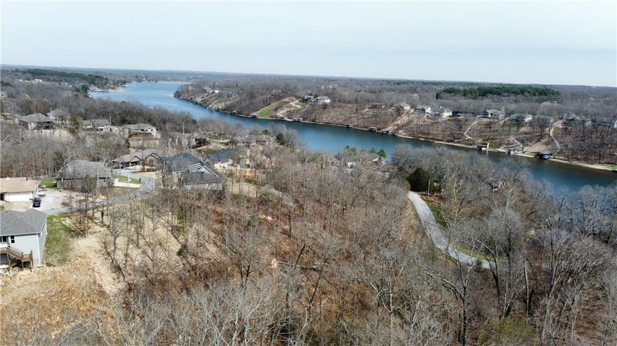 Seize the rare opportunity to build your dream home on this beautiful 0.36-acre hilltop lot in the highly sought-after community of Bella Vista! Situated on the edge of the stunning Loch Lomond, this property offers a picturesque setting with the heavy lifting already done a favorable perc test is already on file, this lot is primed and ready for construction. Enjoy the very best of the Bella Vista lifestyle right at your fingertips. You are perfectly positioned just 1 mile from Tiree Park and Boat Dock for days out on the water, 2 miles from the the Highlands Golf Course, and only 4 miles from the fantastic amenities at the Branchwood Recreation Center. Plus, enjoy quick and easy access to Interstate 49, making commutes to Bentonville an absolute breeze.  Whether you are looking to build a serene full-time residence or the ultimate weekend getaway, this lot offers the perfect blend of natural beauty and incredible convenience. Don't miss out on this prime piece of Bella Vista real estate!