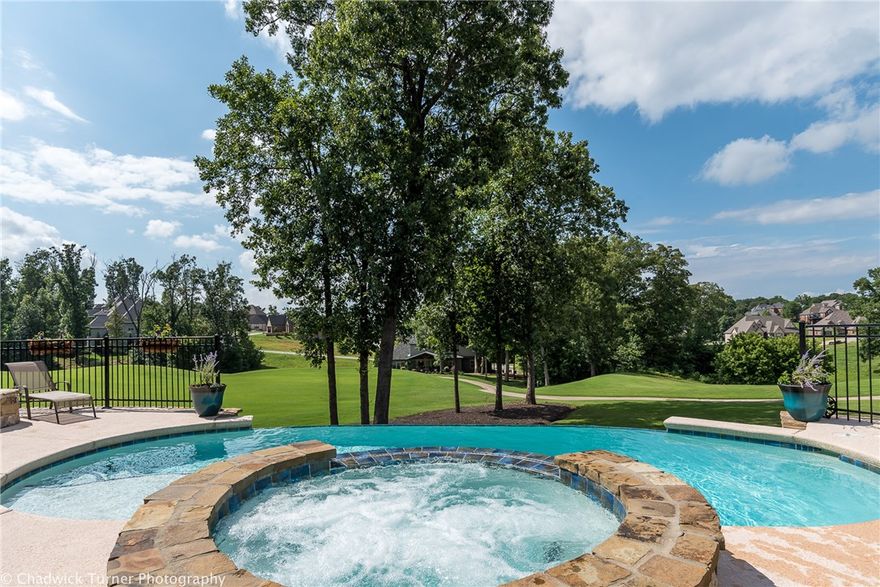 Wanting a home that has it all. Look no further. Resort lifestyle at its best. This stunning golf front home with a infinity pool overlooking the beautiful golf course in every direction is a show stopper. This stunning home has 3 levels of living space with 2 living areas on main level and media  room upstairs with game room complete with kitchen area down. The master suite is on the main level overlooks the golf course, and has a spa-like master bath.Quartz counter tops in the kitchen with a expansive main island.The perfect entertaining home. This is a home you don't want to miss,and will not want to leave.