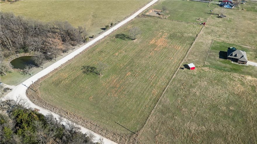 5.02 acres, level and cleared, wonderful location for new home construction in beautiful and peaceful rural countryside. Has road frontage on two sides. Less than a mile from Hwy 72. Carroll Electric available.  Gravette Public Water available. Septic Tank needed. Propane Tank needed unless an all-electric home.  The adjoining 5.80 acres is also listed for sale under ML#1331521 and includes a residence, 3 fenced pastures, metal barn, pole sheds, storage building.