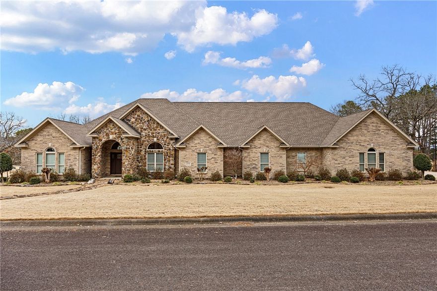 Welcome to 10121 Alyssa, perfectly situated on Chamberlyne golf course in beautiful Danville, Arkansas. This impressive home combines modern elegance with peaceful, scenic surroundings, offering the perfect retreat for golf enthusiasts and anyone who loves refined country living.
Step inside to discover expansive living spaces, soaring ceilings, and abundant natural light that flows throughout the open-concept floor plan. The gourmet kitchen features granite countertops, stainless steel appliances, a large island, and ample cabinetry—perfect for hosting family gatherings or entertaining guests.
The primary suite is a true sanctuary with a private sitting area, spa-inspired bathroom with a soaking tub, and large master closet with custom built-ins throughout. Additional bedrooms are spacious and well-appointed, offering comfort for family or guests with their own private bath each.
Oversized 4 car garage as well as matching detached shop complete with central heat and air as well as 1/2 bath for all your hobbies!