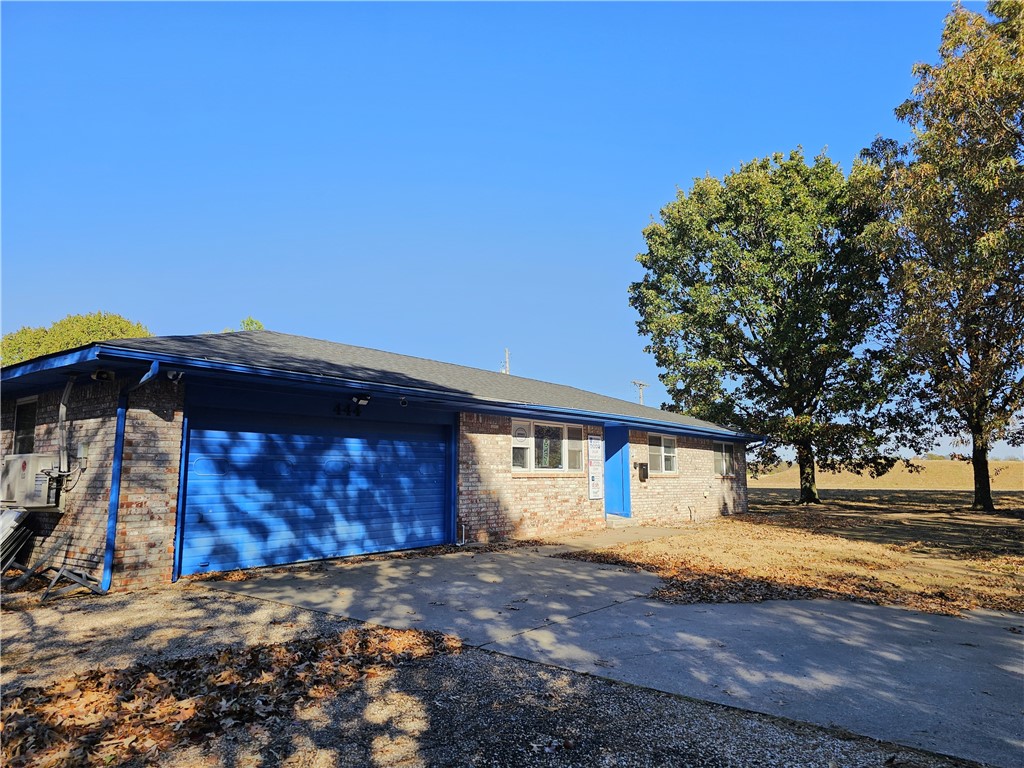 Great Location for your business on 2 acres! The property has the 2400 sft blue building and 2000 sft metal auxilary building. Located 2 minutes from HWY 49 exit 73, .3 mile from one of the busiest Walmart Supercenters, across from Mercy Medical and Starbucks. Approx. 275 ft of road frontage on N 48th St shows around 40,000 VPD. Strategically located just 1 minute from Elm Springs Rd intersection a half mile from I-49, provides easy access to all of Northwest Arkansas. Don't miss out on this great investment opportunity! Rent to Grow your Business or Buy to develop the land. Zoned Commercial C-2.