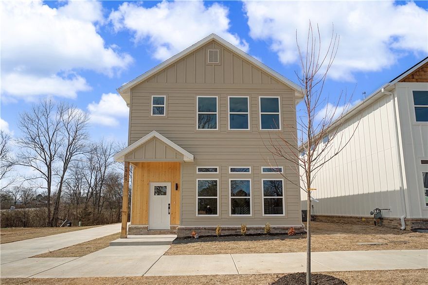 Seller to pay up to $5,000 of buyer’s closing costs, prepaids and/or loan rate buydown. Additional money potentially available from Preferred Lenders to contribute to rate buydown. Could qualify for FHA loan. Details available from lenders. Lender list available. Beautiful new single-family home with 3 bedrooms, 2.5 bathrooms and 2-car garage. All bedrooms upstairs including primary bedroom with on-suite primary bathroom including a walk-in shower, soaking tub and walk-in closet. Inviting open floor plan downstairs with living area with electric fireplace, kitchen with custom cabinets, dining area and powder room/half bath. High main-level ceilings. Laundry is upstairs. Neighborhood green space. Prime location in South Fayetteville that is 1 mile from Happy Hollow Elementary School and also near Mt Sequoyah Woods & Trail & Stonebridge Meadows Golf Club. ~ 3 miles to the U of A and Fayetteville HS. Interior photos are virtually staged and for marketing purposes only. No furniture included.