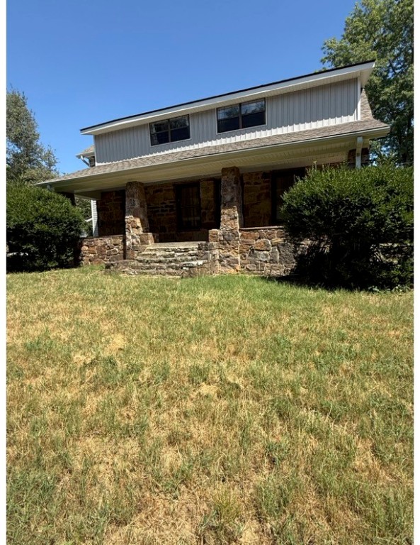 Cute cottage house that has been updated with newer HVAC, roof, water heater, windows, siding. and sliding glass doors. The character of the vintage house has been maintained with the original wood floors and a claw foot tub. This house is set back in the woods, with a level cleared lot, on a paved road. There are 2 wells and a spring, but the house is on public water. Cox high speed internet is available.