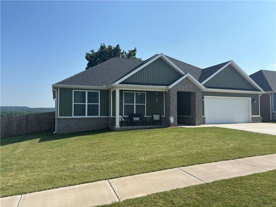 Come see this beauty! This brick home is stunning and has so many positives - larger corner lot (.25A) in a great neighborhood, fabulous view of the mountains from the dining room windows and the covered porch out back, and a large privacy fenced backyard with a magnificent oak tree! The interior is extremely well kept and designed. Split floor plan with Luxury Vinyl Plank flooring throughout. Enormous closet in the primary bedroom, spacious and appealing primary bathroom, neat utility room, 2-car garage, PLUS the refrigerator, washer and dryer ALL CONVEY to the Buyer! This is definitely a Must See!