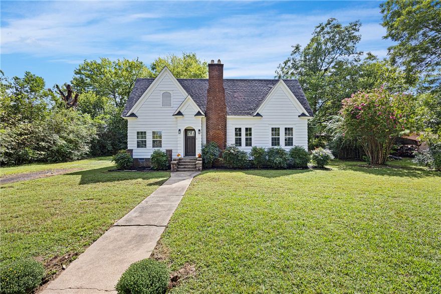 Welcome to 203 Northwest 1st Street, a beautifully updated home in the heart of Atkins. The great room features a cozy fireplace, wood ceilings, and abundant natural light. A large formal dining room and versatile bonus room provide plenty of living space. The remodeled kitchen offers Frigidaire Gallery appliances, gas cooktop, farmhouse sink, new cabinetry, and a flex space for a breakfast table or coffee nook. The primary suite includes an exterior door to a new private deck, while the renovated bath boasts a double vanity and updated shower. Modern upgrades include new wiring, plumbing, a three-year-old HVAC with a programmable thermostat, and all-new doors. Solar panels add energy savings, and generous bedrooms with large closets make this home stand out. Conveniently located near Interstate 40 and central Atkins. Schedule your showing today!
