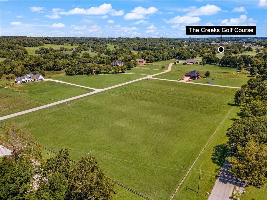 Experience the epitome of rural living with this captivating 2-acre, level lot perfectly nestled within the charming Creekside Estates. Immerse yourself in the tranquility of a country ambiance while reveling in the luxury of being less than a 5-minute drive from the HWY 612 on-ramp, ensuring seamless access to Interstate 49. Delight in the proximity to the beloved Shaw Family Park, a mere 10 minutes away, and the added convenience of reaching XNA airport within 15 minutes. For golf enthusiasts, the esteemed Creekside Golf Course is just steps away. Equestrian aficionados will find their desires fulfilled, as this locale welcomes your beloved horses with open arms. Seize the opportunity to manifest your vision by crafting your dream dwelling amidst this picturesque backdrop, with utilities readily available at the street. Embrace the chance to create a haven that combines the allure of countryside living with modern convenience, right here in the heart of Creekside Estates.