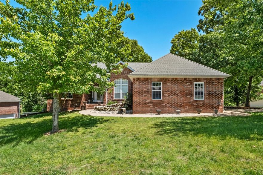 Beautiful 5BR/3.5BA brick home in Dream Valley Estates! Situated on a corner lot (.71 acres) with serene wooded views, main-level primary suite, and formal dining area. 2 car attached garage on the main floor, and spacious 1 car garage off the basement with large storage room attached. A total of 1142 sq ft of garage space and 360 sq ft of storage space. Finished lower level includes 2BR, bath, living room w/fireplace - perfect for in-laws or teens. Quire, upscale neighborhood. Make this your dream home!