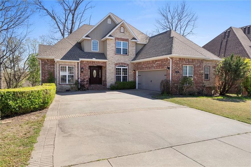 *Up to $4,500 preferred lender credit* Multigenerational home, ideally located minutes from downtown Bentonville, Crystal Bridges, 8th Street Market, trails, & easy highway access. Inside, the spacious kitchen features hardwood floors, granite countertops, & a cozy fireplace in the breakfast nook. Primary bath includes a clawfoot soaking tub, dual vanities, walk-in closet. The fully finished walk-out basement offers flexibility, complete with a large family room, kitchenette, bedroom, full bath, and office, perfect for a private guest suite or mother-in-law quarters. You’ll also appreciate extra storage under the stairs & a workshop with private entrance. Upstairs, 2 additional bedrooms, each with en-suite bathrooms, plus a versatile hobby room. Don't miss the expansive attic which is ideal for finishing into a bonus room or additional storage. Raised deck perfect for entertaining, or relax on the covered patio below, easily accessed from the walkout basement. Roof 2024.