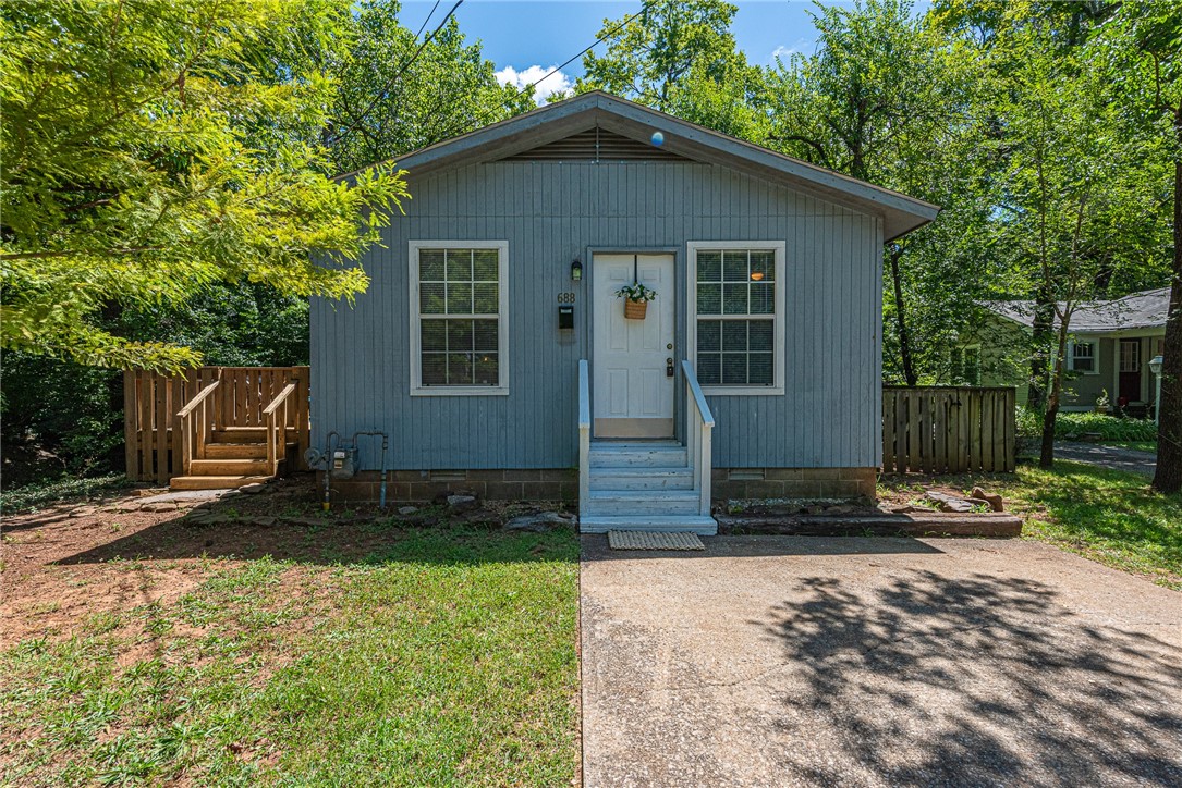 Own a piece of Fayettevilleās Historic District! This 0.25 Acre +/- lot with 1 bd 1 ba home is located near shopping, local eateries, entertainment on Dickson Street and access to Mission Blvd and College Ave! This adorable home would make for a great rental investment with studio living room and kitchen featuring vinyl plank floors and new carpet throughout. Private bedroom and bathroom with laundry hookups! Head out back to the deck and enjoy the neighborhoodās established tree coverage, a private backyard complete with privacy fence, and enjoy the sounds of the stream along the north side of the property! Donāt miss out on this rare find! Schedule a showing today!