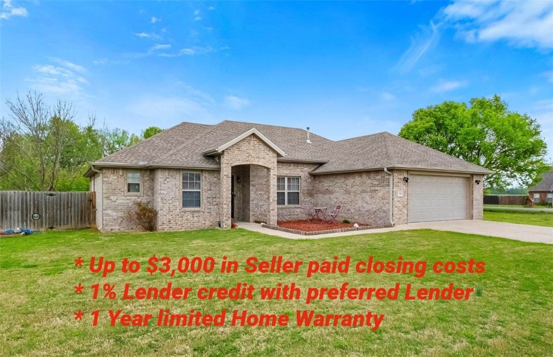 The property features a brick exterior, an attache