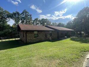 Well maintained home with about 2 acres in Center Valley with two shops, green house, chicken coup, well, storm shelter and fenced yard.