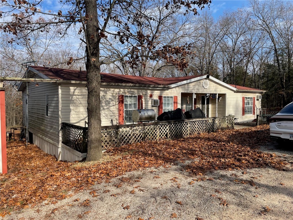 Nice doublewide mobile home selling as is, where is on 3 lots for almost 3 acres. Three bedroom/2 bath with central heat and window air units. Home does need some work. Would make a great fixer-upper. Good well. Call for your tour today. The three lots total 10 acres more or less.