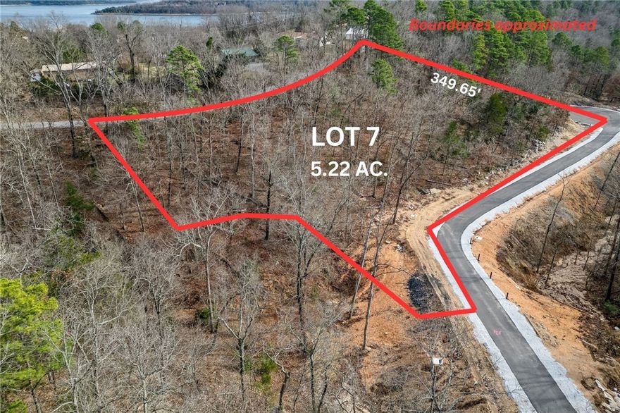 Discover the perfect canvas for your custom Beaver Lake area retreat at Blisslake, a new fully paved subdivision featuring 9 premier estate-sized lots with dedicated community recreation area and lakefront access for all lot owners. This 5.22-acre lot offers the ideal blend of privacy, natural beauty, & proximity to some of Northwest Arkansas' most sought-after amenities. Ideally located at the Northern end of Beaver Lake near Hobbs State Park & Rocky Branch Marina, the property is surrounded by endless opportunities for hiking, biking, boating, & outdoor recreation as well as just 20 minutes from downtown Rogers! The sloping terrain & serene wooded setting provide an exceptional backdrop for a luxury home designed to complement the Ozark landscape. Underground electric & water are available at the street, allowing for a visually clean, unobstructed setting while streamlining the building process. Build your dream home & experience the best of the Natural State!