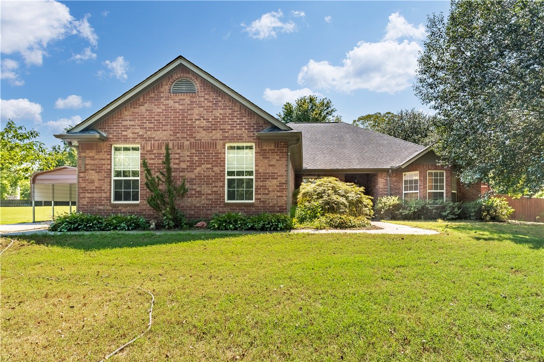 Extremely rare opportunity to own a modern built home on a very large flat lot in this small lake village just east of Springdale. This charming home, just a few yards from Beaver Lake, is waiting for you to make it your own. Enjoy an open living and kitchen area, complete with a butler's pantry for added convenience. The thoughtfully designed split floor plan features Jack and Jill bathrooms, perfect for family living. Step outside to a spacious covered back patio, where you can relax by the soothing fountain and small pond. The property includes a three-car garage, with one bay transformed into a fully insulated craft room or home office, easily convertible back to a garage if needed. Ginormous covered back patio leads you to the spacious back yard. Separate carport and well built backyard shed convey. Plus, the neighborhood boasts two private access points to the lake, with public access just a stone's throw away. Seize this incredible opportunity today!