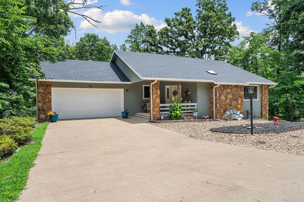 Charming, updated & move-in ready! This 2,062 sq ft home sits on a spacious .5-acre lot. With 2 bedrooms on the main floor & a lower-level bonus suite with a full bath, there’s no shortage of space. The walkout basement & back deck open to a serene backyard, shaded by a canopy of foliage. The sunroom, just off the living room, offers flexible use as a craft room, home office, or playroom. A 2-car garage & 3rd-car covered carport provide ample parking. Updates include: painted exterior(2025), new roof(2022), HVAC(2022), water heater(2024), painted cabinets(2022), engineered hardwood flooring in living room & sunroom, new appliances & fixtures & a retaining wall by the carport. Conveniently located minutes from Branchwood Park, Loch Lomond & the Highlands & Scottsdale golf courses. Looking for more space? The .47-acre lot to the left when facing home(Lot/Block:20/2) is available purchase for additional fee(not listed on MLS). Seller is offering up to $7,800 for buyer to use toward a rate buy-down or closing costs!