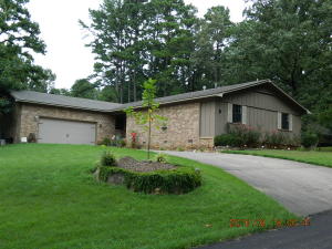 Looking for space??? This home has it. From the sizeable living room w/ wood burning fireplace to the abundant kitchen cabinetry w/ like new stainless steel appliances. Storage through, double closets in master, and a 4th bonus room to make your own. Even the laundry room is large & features a 1/2 bath. The home is in a desirable location on the outskirts of town & has a shop building that provides valuable space for many opportunities.