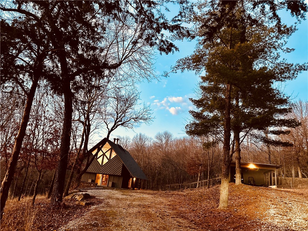 Stunning E. Fay Jones home with mountain views. This truly one-of-a-kind home has high open ceilings, natural light, hardwood floors, open floor plan, a private pond, woods, open field and is in immaculate condition. Partially finished basement to finish as your own heart's desire. Home is offered with 11.36 acres with additional parcels surrounding that can be purchased 1,2,4 for a total acreage of 45 acres!!!! This is a breathtaking home and a must see!!!! Not to mention only a 20 min drive to downtown Fayetteville it has it all and is close to everything NWA has to offer. This home is so gorgeous it's even been featured in Southern Living Magazine. Come see in person today. Also see MLS# 1267973 & 1266071 #3 is not listed but can be purchased with the home to total 45 acres!!!