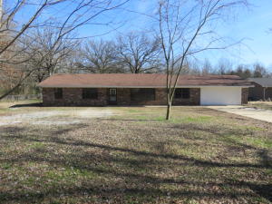 BRIGHT & BEAUTIFUL FROM FLOOR TO CEILING! Brand NEW interior includes new central heat and air, new flooring (waterproof laminate), new bathrooms. You will not believe the kitchen---new LG appliances, cabinets, counter tops! A fresh, platinum palette---feels and looks like a new construction dwelling! Massive family rooms, fireplace, huge laundry room with cabinets! Large lawn is double fenced! POSSIBLE OWNER FINANCING--with specific terms approved by seller.