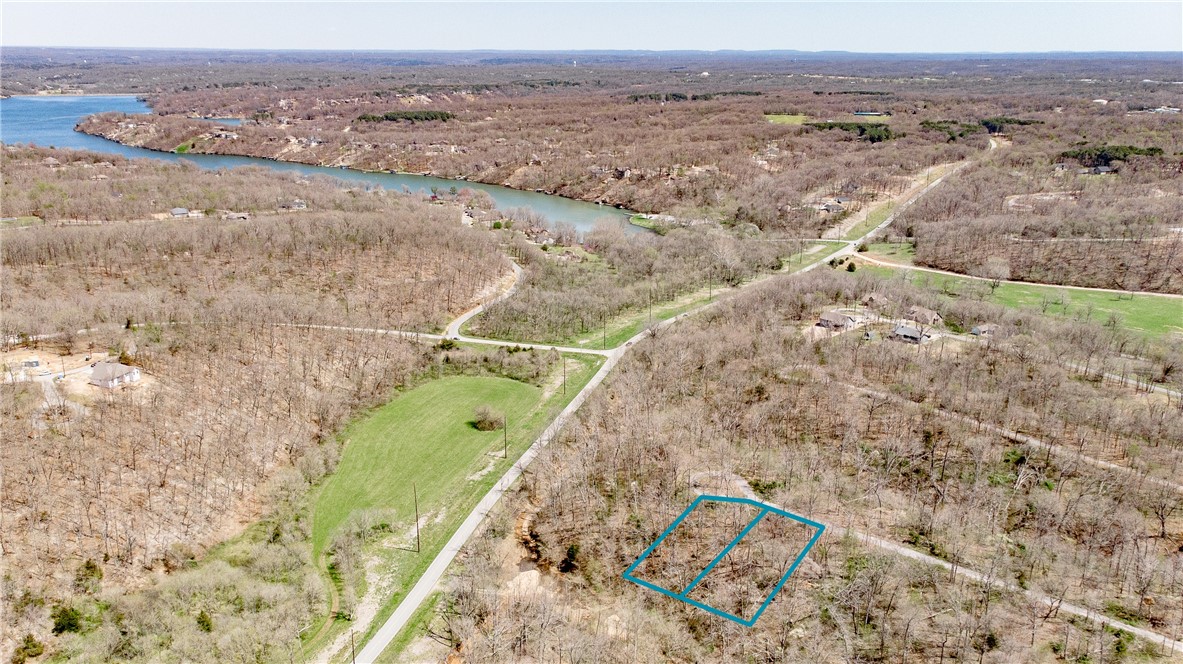 Build your dream home in a prime Bella Vista location. This gently sloped lot sits near the end of a cul-de-sac just off Highland Blvd, offering privacy and convenience. Electric is available at the street and onsite septic is needed. Minutes from Loch Lomond with quick access to Bentonville via the interstate, plus bike trails and community amenities nearby. A wonderful opportunity to create your ideal home in one of Northwest Arkansas’s most desirable areas.