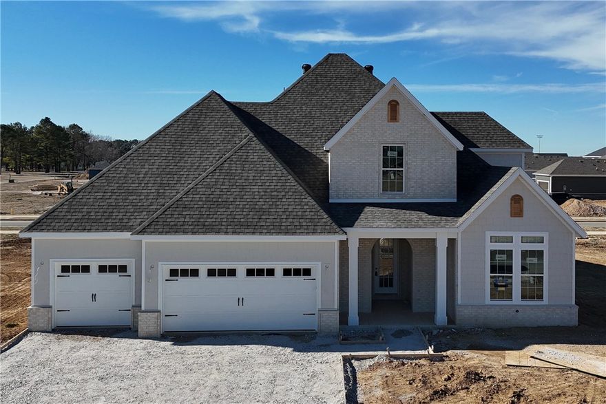 Welcome to County Line Square, a new Springdale community near Shaw Family Park with a pool and pavilion. Step into the entry where a bedroom and full bathroom sit to the right. Continue into the main living area where the living room, kitchen, and dining space connect for easy everyday living. The living room features a fireplace with windows on each side overlooking the covered back patio. The kitchen includes a large island, quartz countertops, cabinets to the ceiling, GE Profile stainless steel appliances, and a pantry. Engineered hardwood floors run throughout the first floor. The primary suite features a vaulted ceiling and a bathroom with a double vanity and centered makeup vanity, a walk-in shower, and a walk-in closet that connects to the laundry room. A mudroom provides access to the 3-car garage. Upstairs you'll find 2 additional bedrooms and a full bathroom. A fence, blinds, and gutters are included. Builder’s preferred lender is offering $3500 toward closing costs or a rate buy down. *Agent Owned*