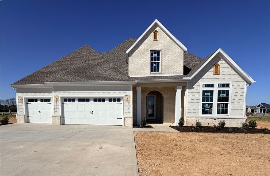 Welcome to County Line Square, a new Springdale community near Shaw Family Park with a pool and pavilion. Step into the Clifton entry where a bedroom and full bathroom sit to the right. Continue into the main living area where the living room, kitchen, and dining space connect for easy everyday living. The living room features a gas fireplace with windows on each side overlooking the covered back patio. The kitchen includes a large island, cabinets to the ceiling, GE Profile stainless steel appliances, and a pantry. Engineered hardwood floors run throughout the first floor. The primary suite features a vaulted ceiling and a bathroom with a double vanity and centered makeup vanity, a walk-in shower, and a walk-in closet that connects to the laundry room. A mudroom provides access to the 3-car garage. Upstairs you'll find 2 additional bedrooms and a full bathroom. A fence, blinds, and gutters are included. Builder’s preferred lender is offering $3500 toward closing costs or a rate buy down. *Agent Owned*