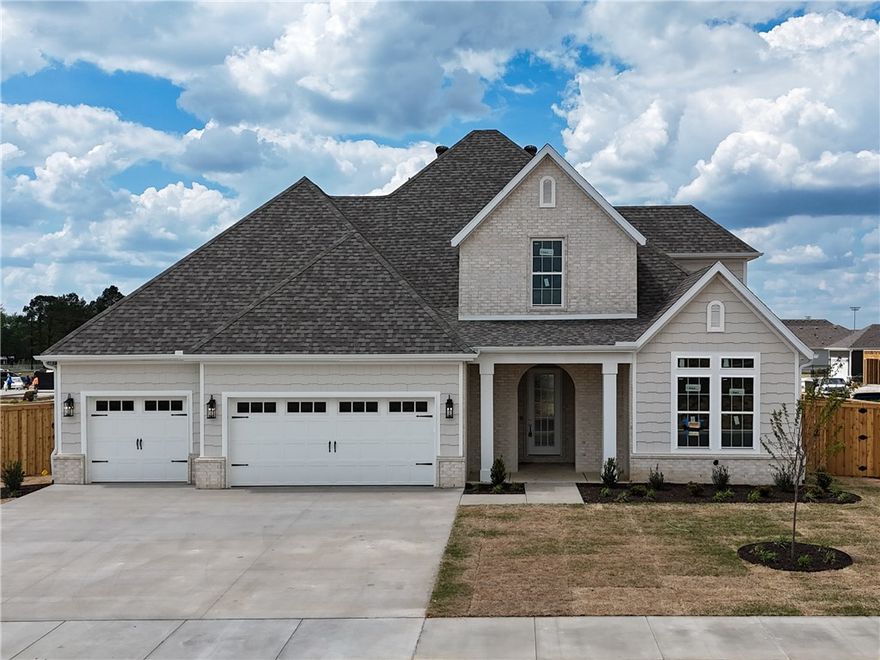 Welcome to County Line Square, a new Springdale community near Shaw Family Park with a pool and pavilion. Step into the Clifton entry where a bedroom and full bathroom sit to the right. Continue into the main living area where the living room, kitchen, and dining space connect for easy everyday living. The living room features a gas fireplace with windows on each side overlooking the covered back patio. The kitchen includes a large island, cabinets to the ceiling, GE Profile stainless steel appliances, and a pantry. Engineered hardwood floors run throughout the first floor. The primary suite features a vaulted ceiling and a bathroom with a double vanity and centered makeup vanity, a walk-in shower, and a walk-in closet that connects to the laundry room. A mudroom provides access to the 3-car garage. Upstairs you'll find 2 additional bedrooms and a full bathroom. A fence, blinds, and gutters are included. Builder’s preferred lender is offering $3500 toward closing costs or a rate buy down. *Agent Owned*