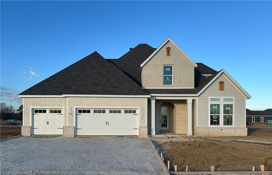 Welcome to County Line Square, a new Springdale community near Shaw Family Park with a pool and pavilion. Step into the entry where a bedroom and full bathroom sit to the right. Continue into the main living area where the living room, kitchen, and dining space connect for easy everyday living. The living room features a fireplace with windows on each side overlooking the covered back patio. The kitchen includes a large island, quartz countertops, cabinets to the ceiling, GE Profile stainless steel appliances, and a pantry. Engineered hardwood floors run throughout the first floor. The primary suite features a vaulted ceiling and a bathroom with a double vanity and centered makeup vanity, a walk-in shower, and a walk-in closet that connects to the laundry room. A mudroom provides access to the 3-car garage. Upstairs you'll find 2 additional bedrooms and a full bathroom. A fence, blinds, and gutters are included. Builder’s preferred lender is offering $3500 toward closing costs or a rate buy down. *Agent Owned*