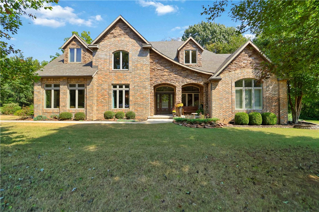 This home sits on 2± acres (with an addl 2 acres available). Step into a dramatic 20-foot entryway leading to a formal living room with a stacked stone fireplace, a formal dining room, office, and a family/media room. Hardwood floors, new carpet and paint, plantation shutters, and double crown molding showcase the home’s quality finishes. The chef-worthy kitchen features travertine and stainless steel appliances.The primary suite provides spa-like comfort with walk-in closets and a luxury bath. Upstairs, you’ll find three additional bedrooms—one with an en-suite bath with two connected by a Jack & Jill—as well as a game room, bar, and French doors opening to a deck. The third floor has a spacious en-suite, perfect for teenagers or guests seeking privacy.Multiple outdoor living areas, covered decks, professional landscaping, irrigation system, and a 3-car garage complete the property. Residentsalso enjoy access to s/d amenities including a community pool, pool house, tennis and pickleball courts, and scenic trails.