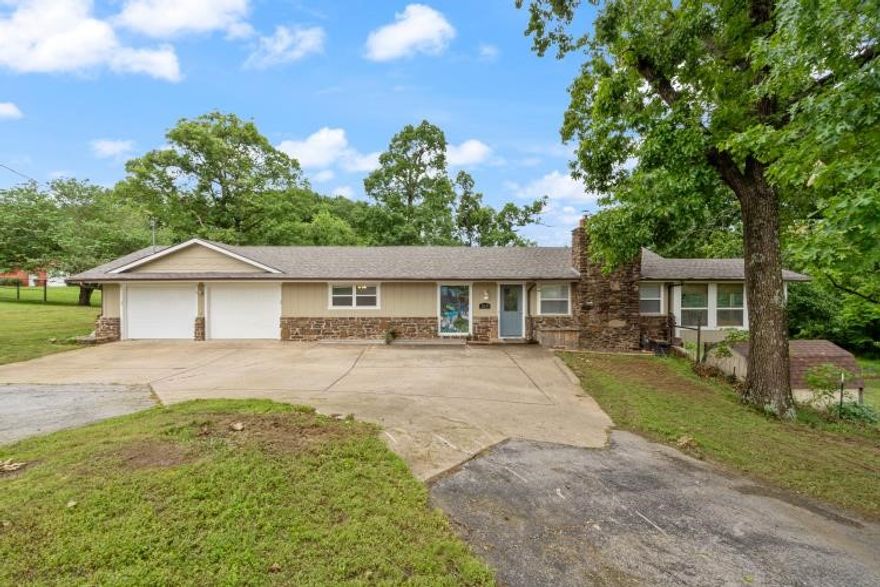 Looking for the perfect blend of country charm and city convenience? Sitting on 2.91 acres of agriculturally zoned land, a haven for animal lovers - bring the chickens, horses, and more! You'll be just minutes from convenient locations in NWA: 6 min to Lost Springs Golf & Athletic Club, 7 min to downtown Rogers and Railyard Park, 8 min to Lake Atlanta/Trails, 10 min to Sams Club, 12 min to downtown Bentonville and only 14 min to the Walmart Home Office! Step inside to an open concept space featuring a sleek kitchen with granite countertops, an island for extra space with an easy flow into the living area with an extra bonus room/office. Downstairs, the finished walk-out basement offers even more living space with a bonus bedroom, walk-in closet and full bath. Outside enjoy the fruit trees and relax while watching the kids play in the treehouse with a climbing wall! Recent updates include HVAC 2022 and roof 2024. Sporting an oversized 2 car garage and 8x12 storage shed, don't miss your chance to snag this rare gem!