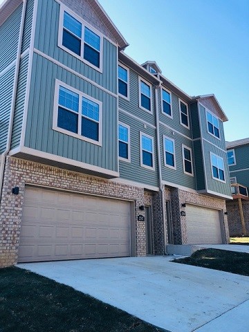 Great location and beautiful finishes! This 2 bed 2.5 bath 2 car garage townhome is conveniently located with easy access to I-49, shopping, the University of Arkansas, and Centennial Park. Gray and white color scheme throughout; open concept living. Kitchen has granite counters, stainless appliances (including refrigerator), island, and pantry. Nice sized deck off kitchen and living area. Full size washer and dryer located on top floor by the bedrooms. Ground floor has nice sized two car garage. Available late April for move in. No showings until after April 8 and current tenant has vacated. Photos may be of a similar unit and are representative of the layout and finishes in the unit