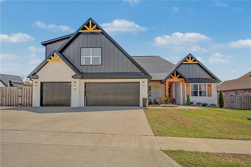 Located in Mill Park Subdivision in Elm Springs, this is the one you've been waiting for! This home sits on a corner lot and offers 5-bedrooms, 3.5-bathrooms and shows like a model home! Upon entering, you'll be greeted by an open floorplan with vaulted ceilings in the living, wood beams, and a gorgeous focal fireplace with custom built ins. Gorgeous kitchen with custom inset cabinetry that leads all the way to the ceiling for that high end look. Main floor features a large primary bedroom and ensuite, complete with a convenient connection to the laundry room. Additionally, 3 more bedrooms are situated on this level. Upstairs, discover a large bedroom or bonus room with its own ensuite bathroom. Relish in moments of tranquility on the covered deck. The expansive backyard offers ample space for all of your outdoor entertaining needs. On the side, it's complete with a play area perfect for the littles. Prime location in the heart of Northwest Arkansas just minutes away from all the attractions NWA offers.