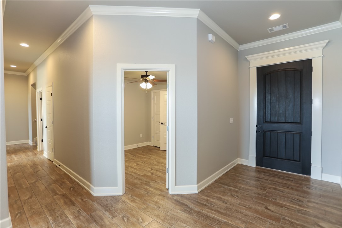 Gorgeous NEW construction home in Tamarron subdivision. Located in Bentonville school district, just across from the new Grimsley Junior High and minutes from Bentonville West High School. Three bedrooms plus office/library on main level with a 4th bedroom(optional Bonus Room) on second level. Two full baths on main floor and one full bath upstairs. Large living area, open kitchen with an eat-in area. Includes granite counter tops, 2" faux wood blinds, gutters, fully sodded yard, and wood privacy fence.