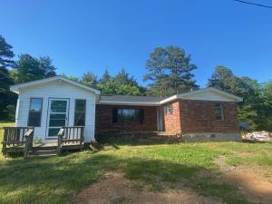 Cozy 3 bedroom, possible fourth bedroom, 2 bath, 1,400 sq. ft. brick home that has new floors, paint and a few other updates. This home sits on 1.20 acres just outside of Clarksville. Seller is in the process of having house pressure washed and brick painted. Call today for your showing.