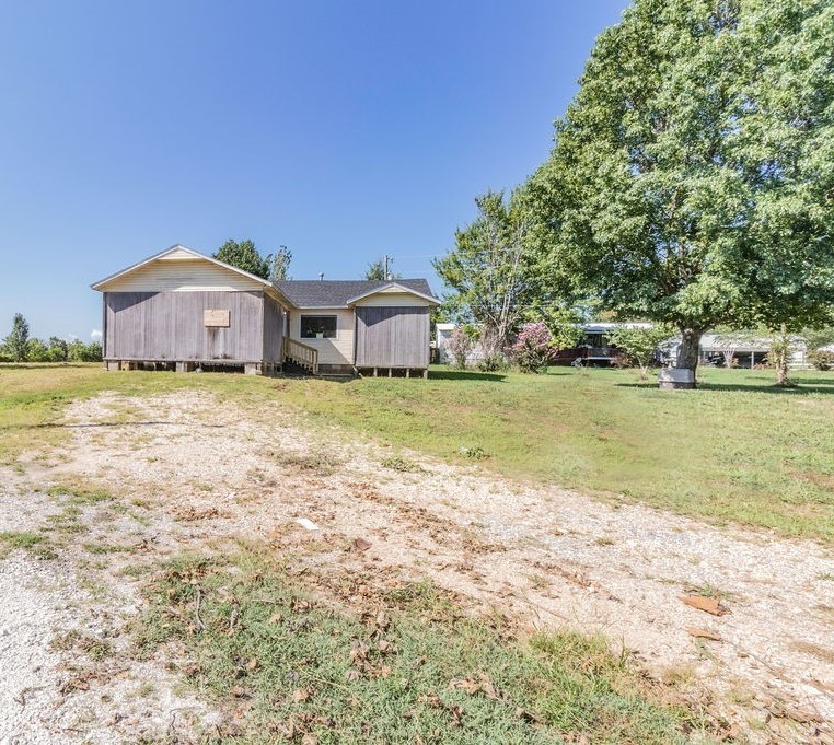 Investor Special! Property is sold-as! Tons of potential sitting on 1 acre! Outbuilding has concrete flooring and hooked up with electric. Just outside of town, yet close to shopping and schools with easy access to US-62. Bring your creativity and see the possibilities today!