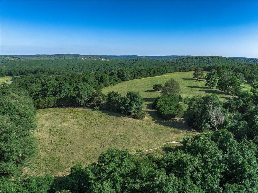 Convenient country setting nestled in the Ozark Mountains. 150 acres MOL. Fully fenced and cross fenced, with amazing views, fields, and woods. 2 ponds with abundant wildlife. Great location minutes from I49, 25 mins to Fayetteville, 45 mins to Ft. Smith.
