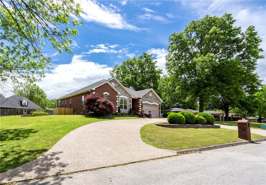 Welcome to your newly updated home! 3 bedrooms, 2 baths, & a gorgeous sunroom with REAL hardwood flooring & tile in the wet areas! Kitchen has granite, brick stack tile backsplash, SS appliances, gas stove, & a walk-in pantry with floor-to-ceiling shelving. Open concept-you can arrange furniture for what fits you best! You have the option of using a portion of the sunroom as the dining area or have an eat-in kitchen. Large bedrooms. Primary suite has walk-in closet, dual sinks, jetted tub & shower. Utility room w/ soaking sink fits both stackable W/D,or have one unit on each side. Relax & unwind in the sunroom, perfect for enjoying your morning coffee. Garage has great storage! Large .38 acre yard & patio provide plenty of room for outdoor gatherings. Backyard has iron & picket fencing. Low maintenance brick & stone exterior. Just outside of city limits, this popular subdivision features large lots & walking trails. Far NW corner of lot is in flood zone-house is not, no flood insurance required. Assumable FHA loan.